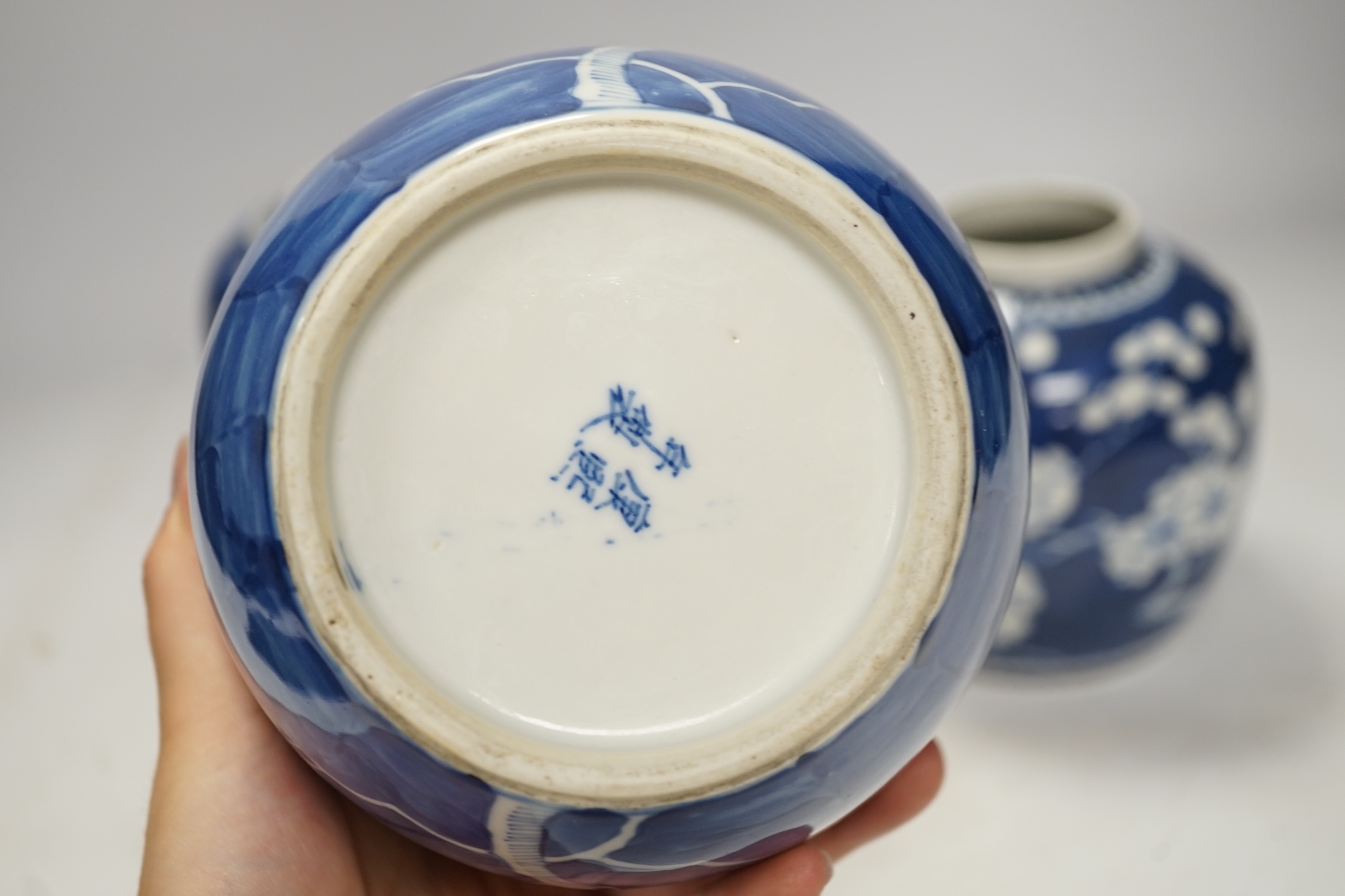 Four Chinese blue and white prunus jars (without covers), tallest 13.5cm. Condition - good
